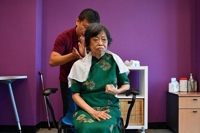 Above: Hairstylist Jacqueline Lee giving Madam Ng a haircut in a salon with pictures of icons from the 1980s. Left: Massage therapist Quek Chin Poh giving Madam Ng a massage, which cost her "20 cents". Madam Jennifer Ng choosing snacks at the minimar