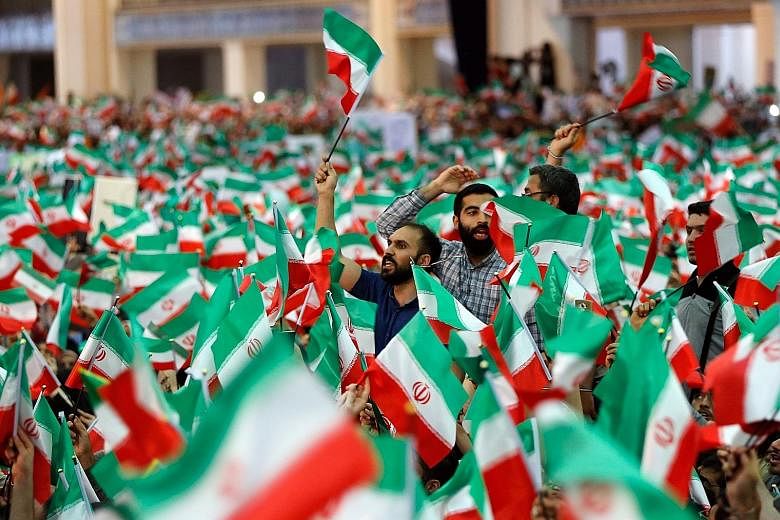 Supporters of Mr Ebrahim Raisi at a presidential election campaign rally in Teheran on Tuesday.