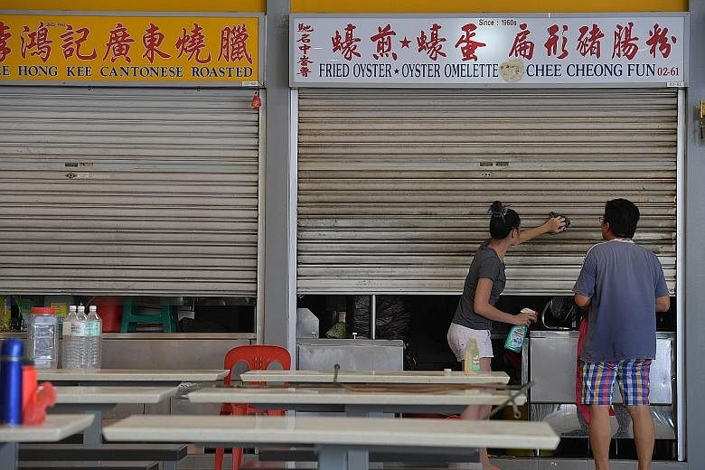 Stall owners busy preparing yesterday to get ready for the market's reopening tomorrow after a three-month makeover. The hawker centre has been installed with seven high-volume, low-speed fans; six LCD screens; energy-efficient lights, such as LEDs; 
