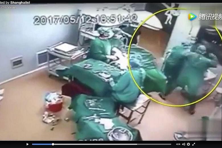 CCTV footage showing two medical workers fighting in an operating theatre has gone viral in China. The incident allegedly happened in Lankou, Henan province.