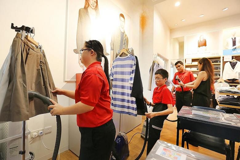 At Retail@DSS, students learn how to fold and arrange clothes, iron them with a clothes steamer, and manage the fitting room, among other tasks.