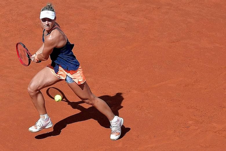 Angelique Kerber of Germany hitting a backhand against Estonia's Anett Kontaveit in the second round of the Italian Open on Wednesday. The world No. 68 Kontaveit won 6-4, 6-0.