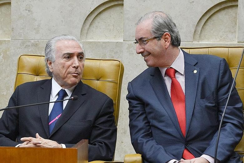 President Michel Temer (left) with former speaker of the lower house of Congress Eduardo Cunha. The President, in a statement from his office, denied requesting payments to obtain the silence of Cunha.