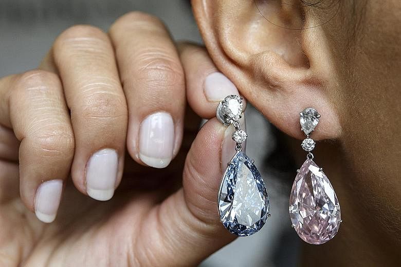 An unnamed Asia-based buyer netted both the earrings at an auction.