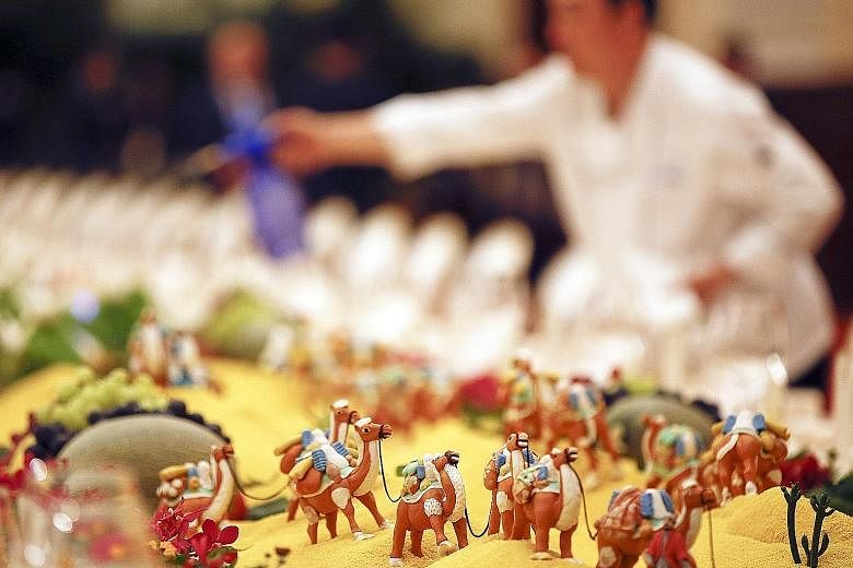 The set-up at Beijing's Belt and Road Forum welcome banquet this week included food sculptures of camels that plied the Silk Road. At the forum, President Xi Jinping said China would "foster a new type of international relations" based on mutual coop