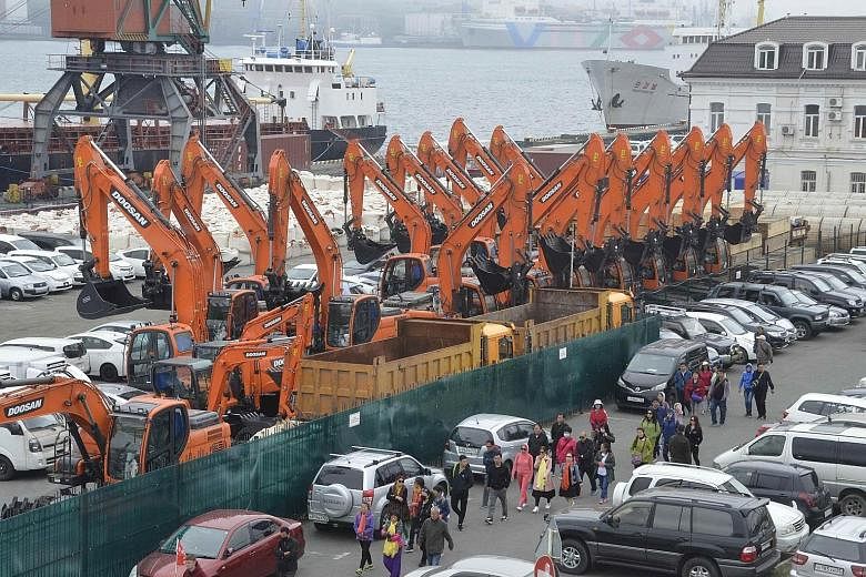 People arriving at Vladivostok on Thursday via the new ferry service, which began despite US calls to isolate North Korea.