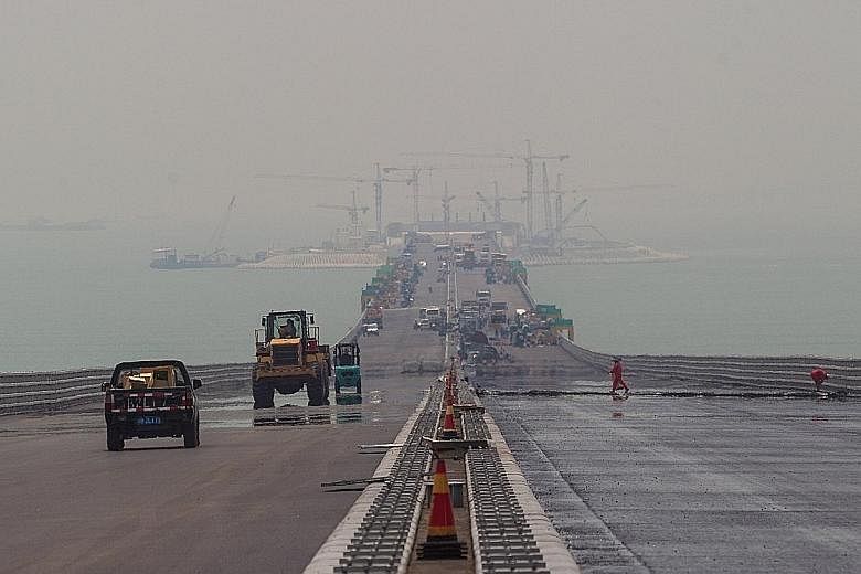 A photo of the Hong Kong- Zhuhai-Macau Bridge construction site in Zhuhai, Guangdong province, taken last Wednesday. After nearly eight years of construction, the cost of the project has ballooned to some US$19 billion, at the last estimate. Most con