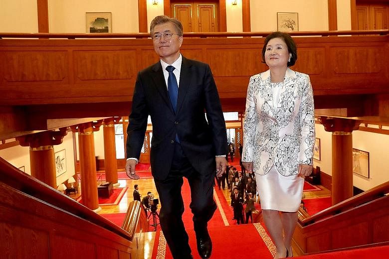 Mr Moon Jae In and his wife, Ms Kim Jung Sook, arriving at the presidential Blue House in Seoul on May 10. Her decision to eschew the traditional hanbok for his inauguration ceremony has been cited as a signal that she might well stray from the more 