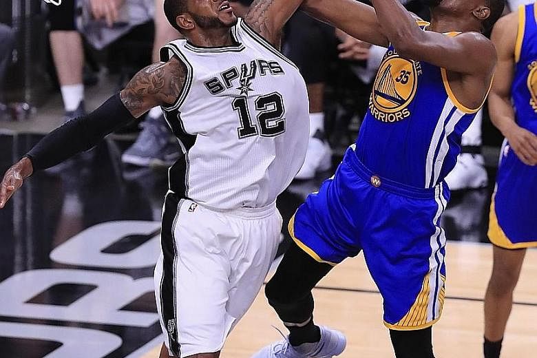 Golden State's Kevin Durant, who scored 33 points in Game Three, driving to the basket as San Antonio's LaMarcus Aldridge blocks him. The Spurs, with Tony Parker and Kawhi Leonard already out, suffered another blow when David Lee was injured in the f