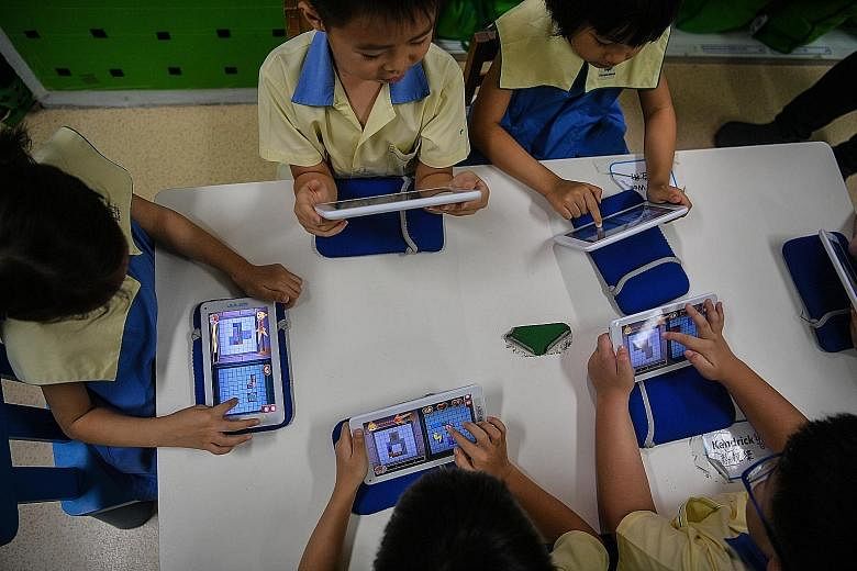 Children at Carpe Diem Juniors playing the Manta Match Mania game on the School of Fish app, developed by education firm Jules Ventures for use in pre-school settings. They spend an hour each week on the curriculum, playing games and reviewing what t