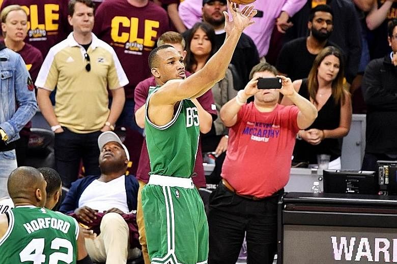 Avery Bradley of the Boston Celtics hits the winning basket against the Cleveland Cavaliers. Bradley's three-point shot took its time to go in off the rim, leaving the defending champions Cleveland with virtually no time to respond as Boston got thei