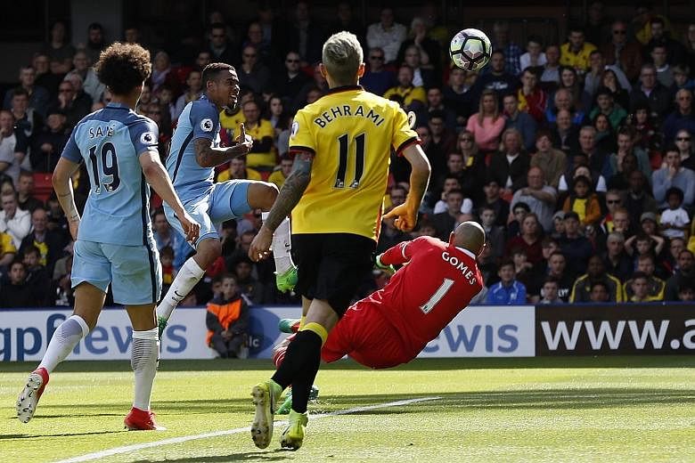 Gabriel Jesus lifting the ball over Watford goalkeeper Heurelho Gomes for Manchester City's fifth in their 5-0 whipping of Watford, sealing third spot in the league in Pep Guardiola's first season in England.