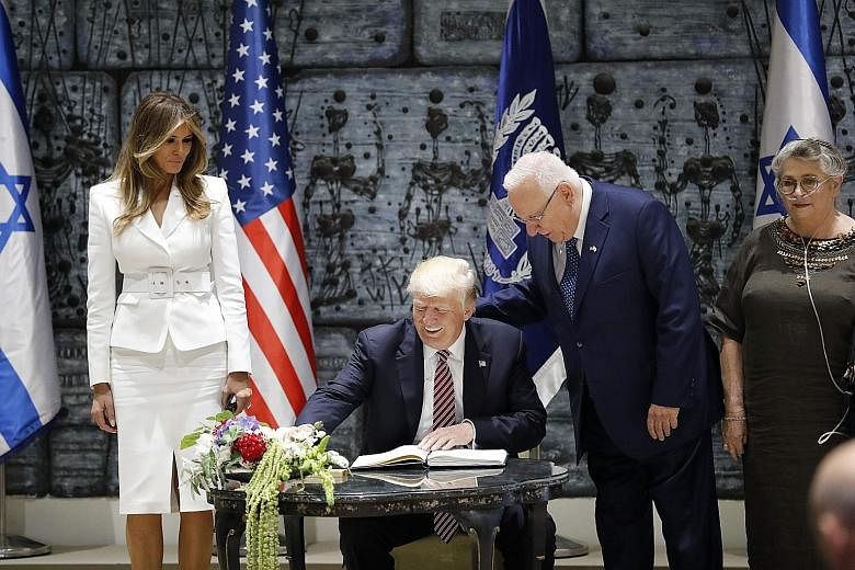 (From left) US First Lady Melania Trump and President Donald Trump with Israel's President Reuven Rivlin and his wife Nehama at the President's Residence in Jerusalem yesterday. Mr Trump travelled to Israel from Saudi Arabia, where he signalled a ret