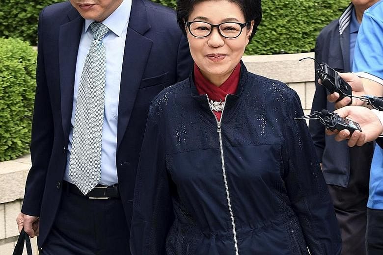 Park arriving for the trial yesterday. She has been held at Seoul Detention Centre since her arrest on March 31 and faces more than 18 charges, including abuse of power and extortion. Former South Korean president Park Geun Hye (left) in Courtroom No