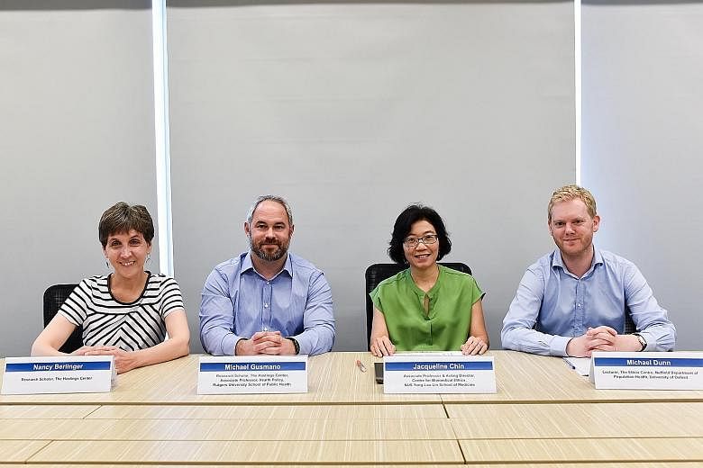 The casebook was co-edited by (from left) Dr Nancy Berlinger and Dr Michael Gusmano from The Hastings Centre in the US, NUS Associate Professor Jacqueline Chin, and Dr Michael Dunn from the Ethox Centre in Britain.