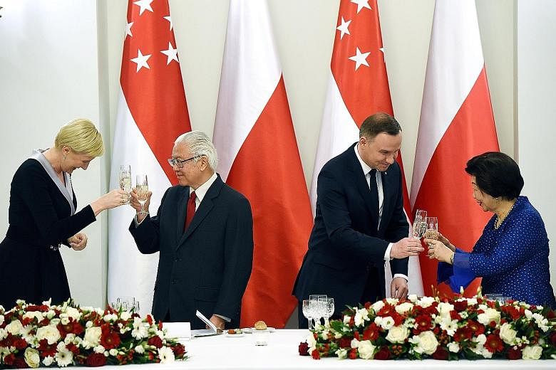 President Tony Tan Keng Yam and Polish President Andrzej Duda, with Mrs Mary Tan and Mrs Agata Kornhauser-Duda, at an official dinner at the Presidential Palace in Warsaw on Monday. The Singapore President ended his state visit to Poland yesterday, a