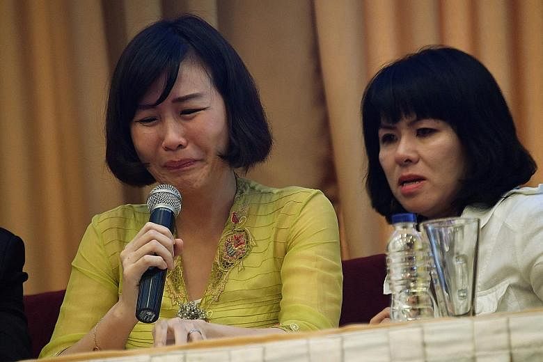 Ms Veronica Tan (left), with her sister-in-law Fifi Lety Indra, reading out an impassioned letter by her husband Basuki Tjahaja Purnama (right, speaking to his lawyers after the guilty verdict in his blasphemy trial in Jakarta on May 9) at a press co