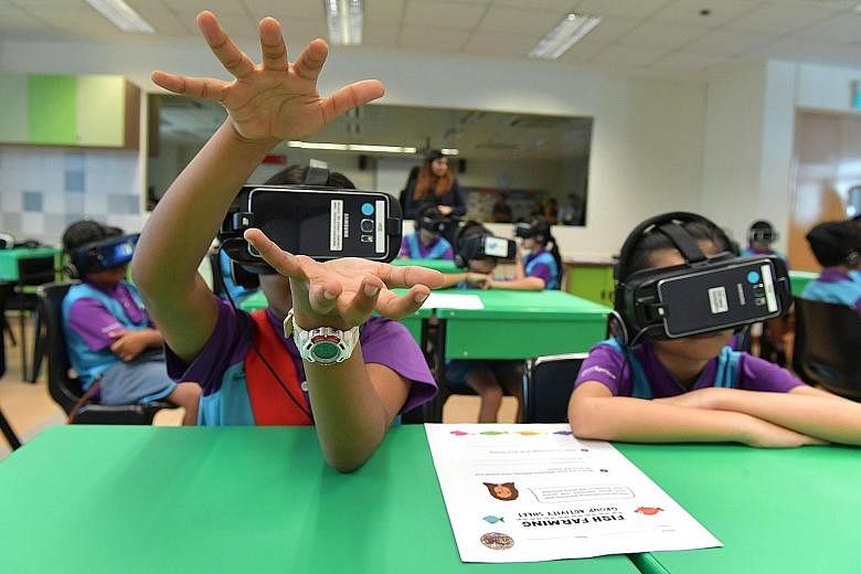 West Spring Primary School pupils taking part in a pilot virtual reality project, where they "visited" two farms while in the classroom.