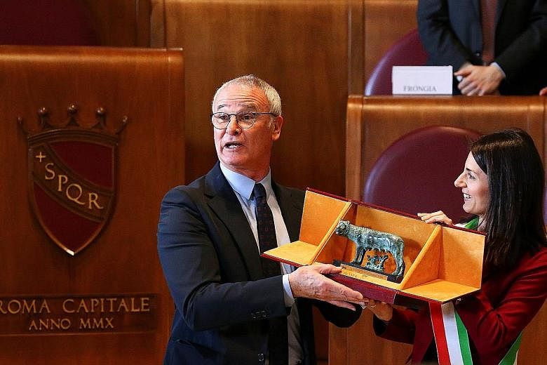 Claudio Ranieri receiving the "Lupa Capitolina award" from Rome mayor Virginia Raggi. The former Leicester manager has not ruled out a move back to the Premier League.