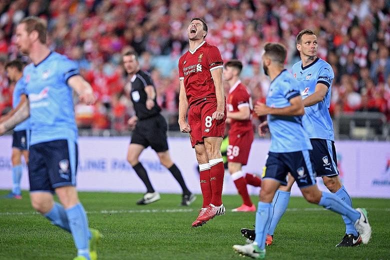 Liverpool great Steven Gerrard reacting after missing a shot at goal during the exhibition match against Sydney FC.