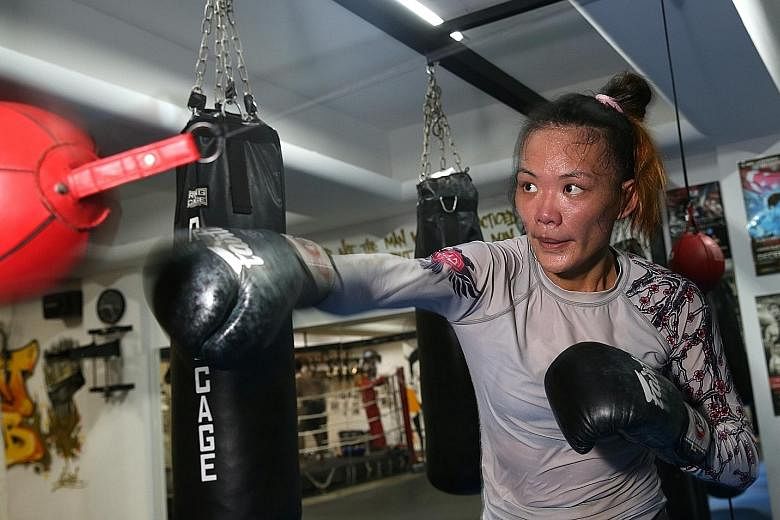 Singapore MMA fighter Tiffany Teo during Tuesday's training session at Juggernaut Fight Club's new gym on Syed Alwi Road. She will be looking to extend her perfect 5-0 career record when she takes on American Rebecca Heintzman- Rozewski tomorrow at O