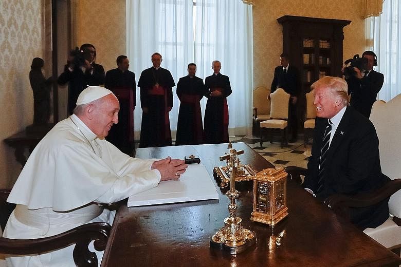 Pope Francis and US President Donald Trump at the Vatican yesterday. Their meeting, which lasted for less than half an hour, started on a subdued note but ended with both leaders beaming.