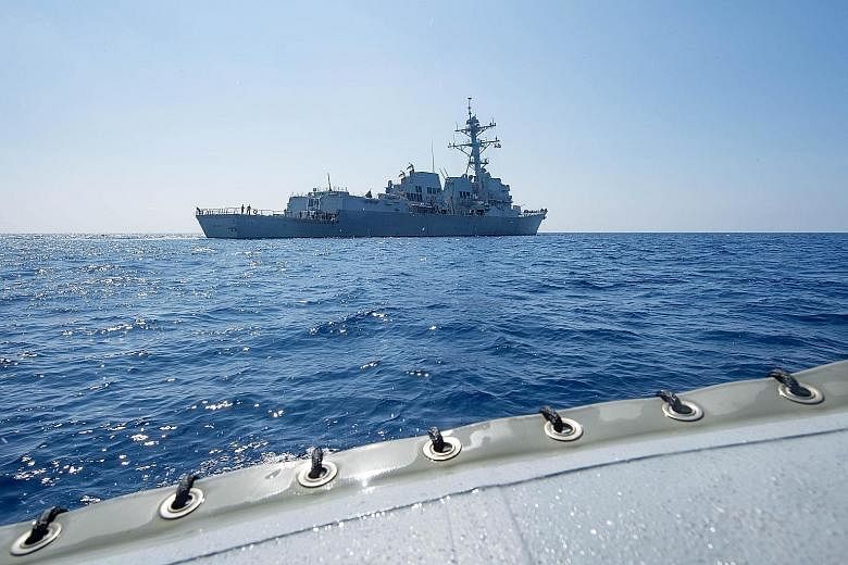 Guided missile destroyer USS Dewey seen in the South China Sea on May 6. The warship sailed within 12 nautical miles of Mischief Reef, in the Spratly Islands, as part of an operation under President Donald Trump, sparking ire from the Chinese. This i