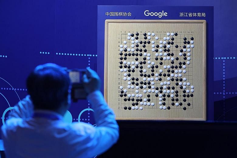 A board shows Tuesday's match between Chinese Go master Ke Jie and AlphaGo, during the Future of Go Summit in Wuzhen, China. AlphaGo's triumph in China offers a marketing boost for Google.