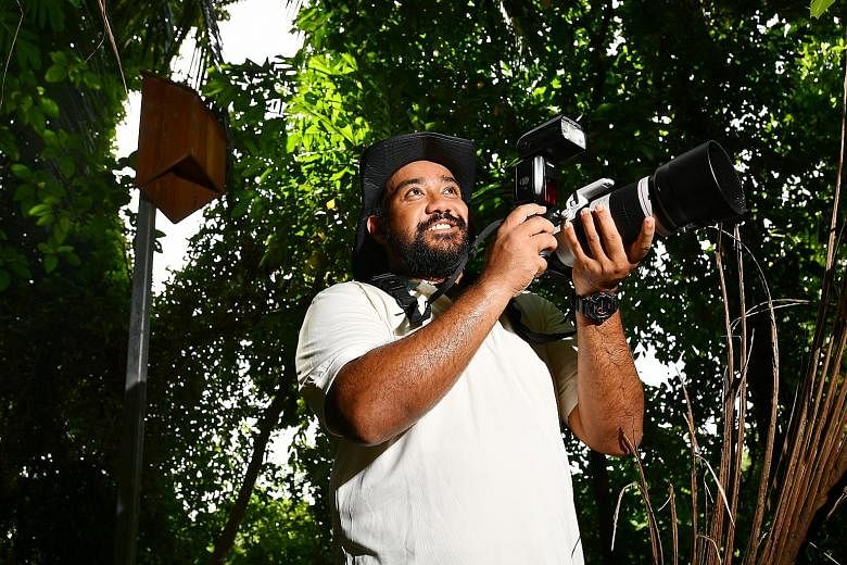 Mr Noel Thomas with a camera he uses for bat surveys, in front of a bat box on Pulau Ubin. About 30 bat boxes and two bat houses, man-made structures for bats to roost in, have been set up across Pulau Ubin to promote the growth of more colonies and 