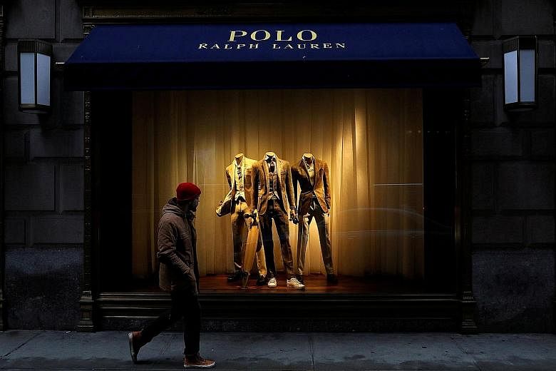 Ralph Lauren's flagship store in Fifth Avenue in New York. If the US economy continues to perform as expected, with continued job and wage growth leading to a rebound in consumer spending and business investment, "most participants judged... it would