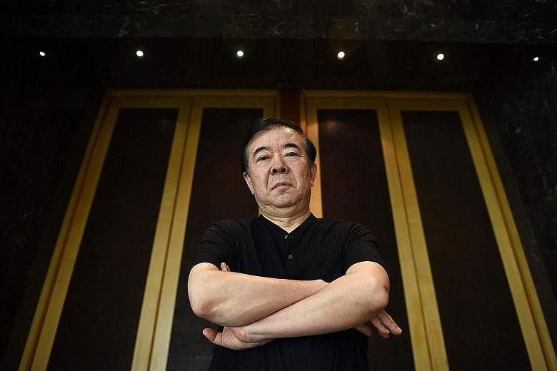 Novelist and screenwriter Zhou Meisen (above) captivated Chinese audiences with In The Name Of The People (starring Wu Gang, below), the first drama showing high-level government corruption to air in the country in more than a decade.