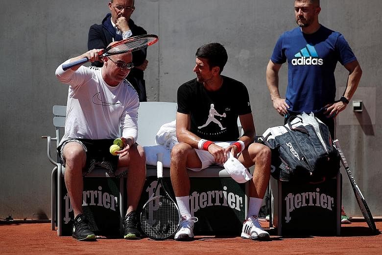 Former world No. 1 Andre Agassi (left) at Roland Garros with French Open defending champion Novak Djokovic, who hired the American as his coach this week, after losing to 20-year-old Alexander Zverev of Germany in the final of the Italian Open last S