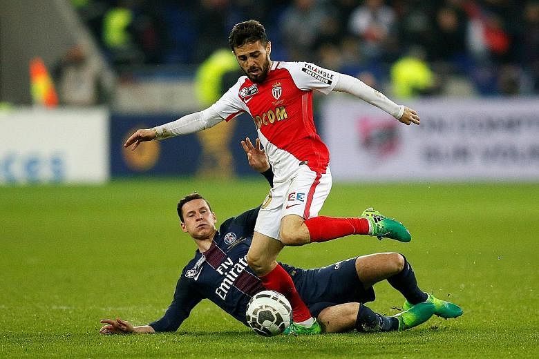 Monaco's Bernardo Silva avoiding a tackle by Julian Draxler of Paris Saint-Germain in the French League Cup final last month. PSG won 4-1 but it was Monaco who had the last laugh with Silva contributing eight goals and nine assists as his team were f