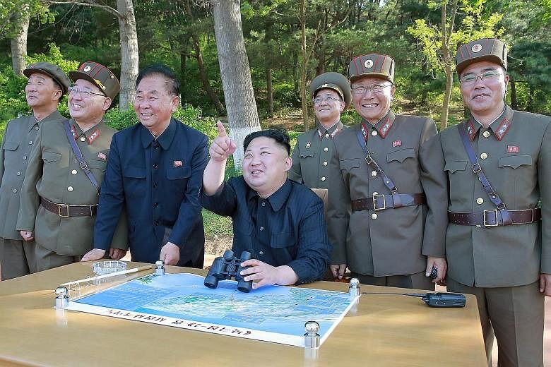 Mr Kim Jong Un at the ballistic missile Pukguksong-2's launch test with Mr Kim Jong Sik (second from left), Mr Ri Pyong Chol (third from left) and Mr Jang Chang Ha (right) in this undated photo released by North Korea's Korean Central News Agency on 
