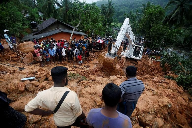 A rescue mission under way yesterday after a landslide at Bellana village in Kalutara district. Other areas badly affected by the monsoon rains include Galle, Matara and Ratnapura in Sabaragamuwa province.