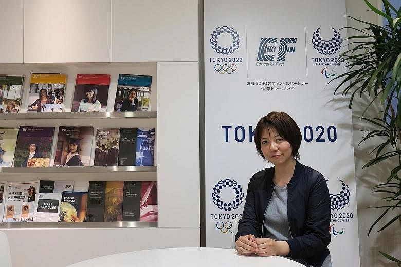 Besides having bilingual street signs, Tokyo is also getting the Japanese to brush up on English. Ms Mariko Tomi (left) was in Singapore for two months under an English course run by official Games partner EF.