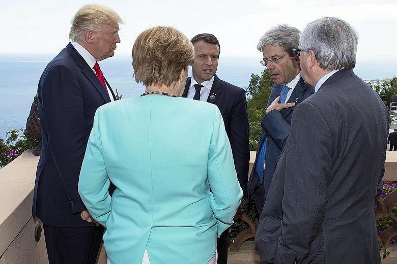 (From left) United States President Donald Trump, German Chancellor Angela Merkel, French President Emmanuel Macron, Italian Prime Minister Paolo Gentiloni and European Commission president Jean-Claude Juncker on the second day of the G-7 Summit in I