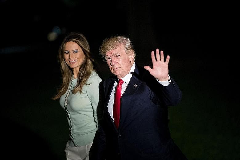 US President Donald Trump and First Lady Melania Trump arriving at the White House last Saturday following a nine-day official trip.