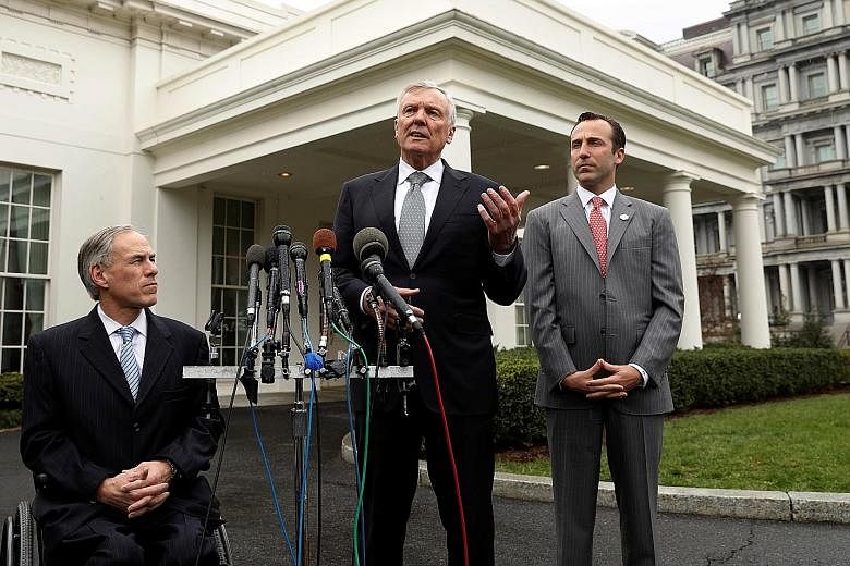 (From left) Texas Governor Greg Abbott, Charter Communications CEO Thomas Rutledge, and assistant to the President for intragovernmental and technology initiatives Reed Cordish at the White House last Wednesday.