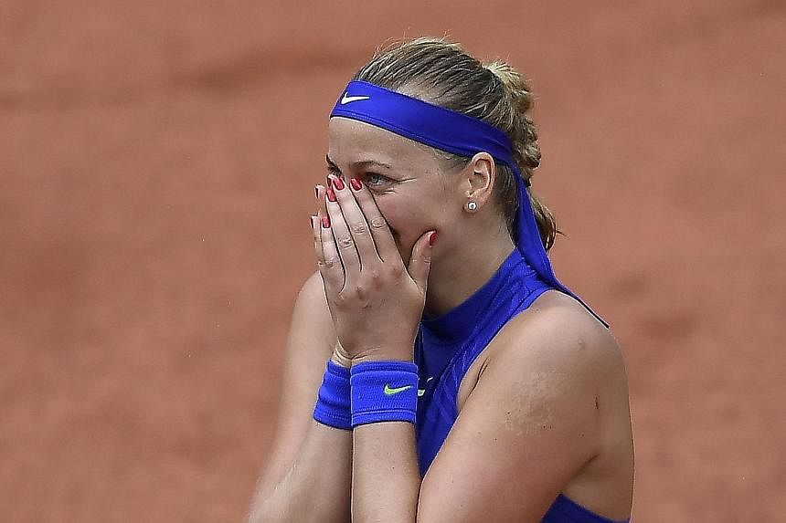 An emotional Petra Kvitova after becoming the first player to reach the second round. Her left hand was badly injured in an attack late last year.