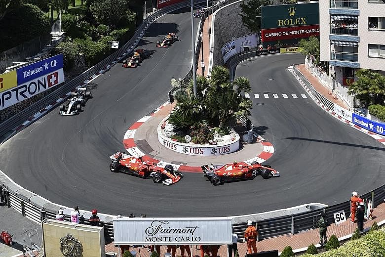 Kimi Raikkonen just ahead of Ferrari team-mate Vettel going round the Grand Hotel Hairpin. Though he tried to put up a united front, he would not have been happy with being pitted first.