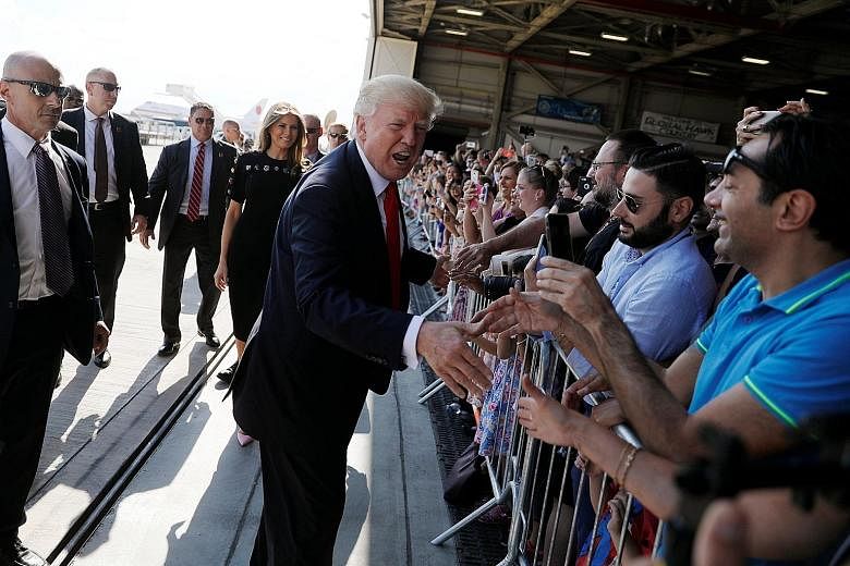Mr Donald Trump greeting US service members at a rally in Sigonella Air Force Base at the end of his participation in the Group of Seven summit in Sicily, Italy, last Saturday.