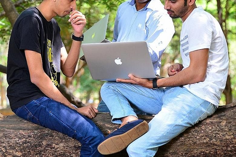 Mr Anand Prakash (right), who runs cyber security firm AppSecure India, meeting fellow ethical hackers at a public park in Bangalore recently. India's army of ethical hackers earn millions protecting foreign corporations and global tech giants from c