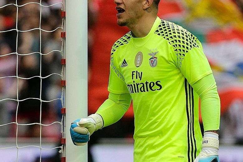 Benfica goalkeeper Ederson celebrating a goal in the league against Vitoria, whom they beat again in Sunday's Cup final to complete a double. United are also keen on him as David de Gea is expected to leave.
