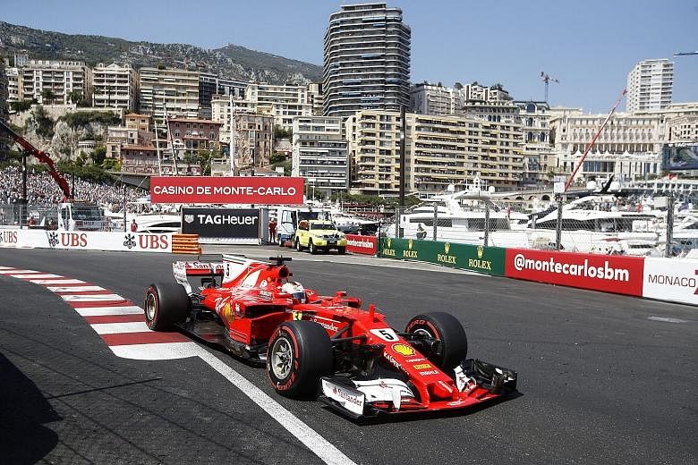 Ferrari's Sebastian Vettel on his way to winning the Monaco Grand Prix - his third victory in six races this season - to lead Lewis Hamilton by 25 points in the world championship.