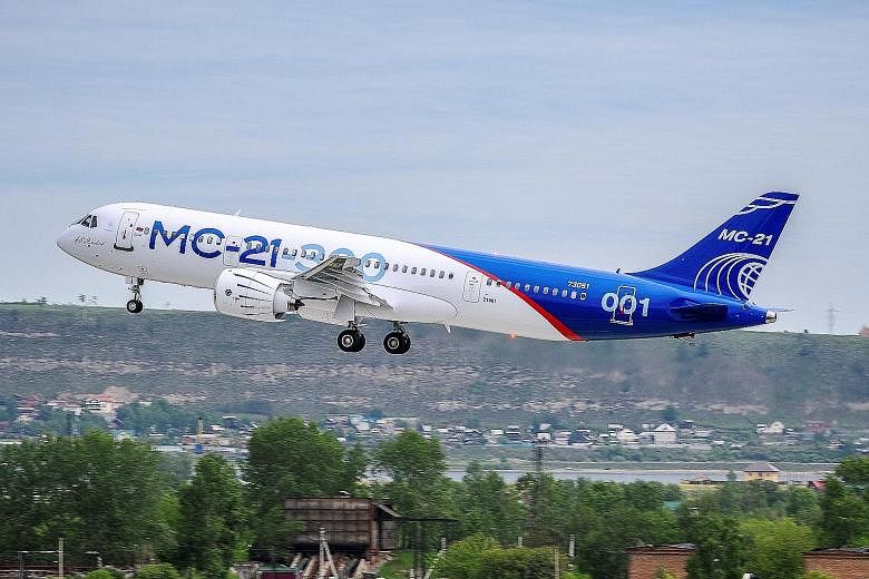 An MC-21 medium-haul passenger plane produced by Irkut Corporation taking off in Irkutsk, Russia, on Sunday. It can fly up to 6,000km and is designed for the mass-market travel industry.
