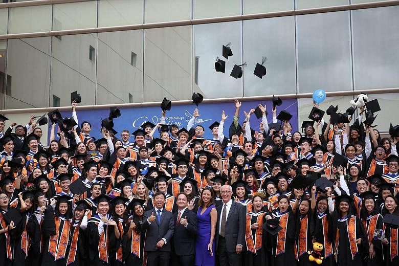 Yale-NUS College's first graduating batch of students with Yale-NUS president-designate Tan Tai Yong (from centre left), Yale-NUS founding president Pericles Lewis, Yale-NUS executive vice-president (administration) Kristen Lynas and Yale-NUS executi