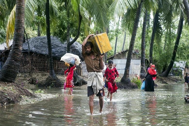 Cyclone Mora hit Bangladesh yesterday, killing at least five people. Residents near the coast in the Cox's Bazar district in south-eastern Bangladesh's Chittagong city were among the nearly 600,000 people who fled to safer areas in the face of the de