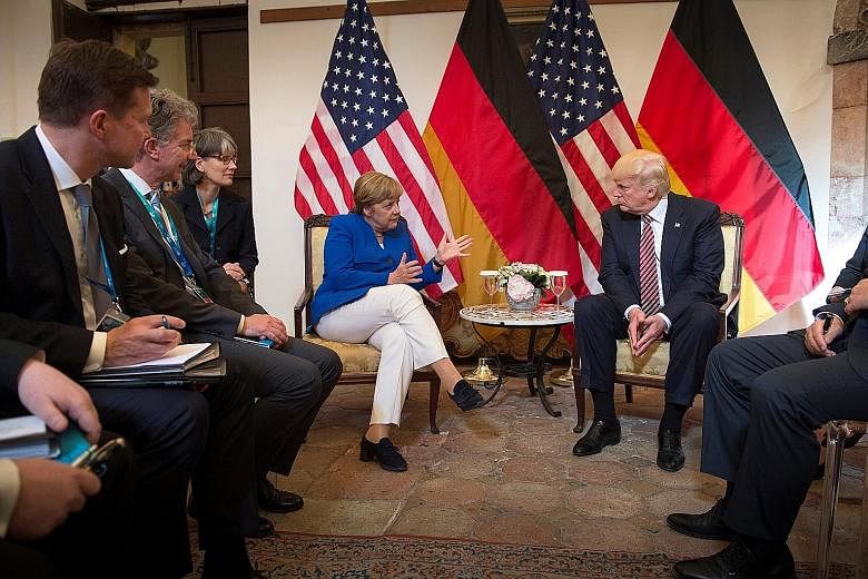 German Chancellor Angela Merkel and US President Donald Trump meeting before talks at the G-7 summit in Italy last Friday. In the aftermath of Mr Trump's visit to Europe, Dr Merkel warned at an election rally in Munich: "The times in which we can ful