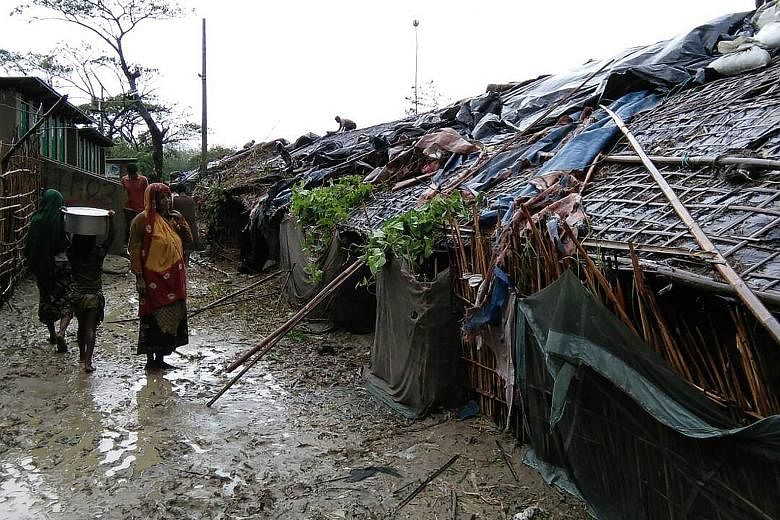 Rohingya refugees at a camp in Cox's Bazar on Tuesday after Cyclone Mora struck. At least 16,010 homes in such camps were destroyed or damaged.